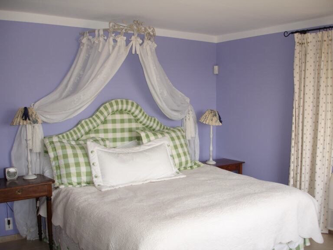 Another master bedroom with king size bed and walk in closet